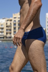 Side view of a man wearing breezefit hybridtrunks highlighting the genispace anatomical feature.