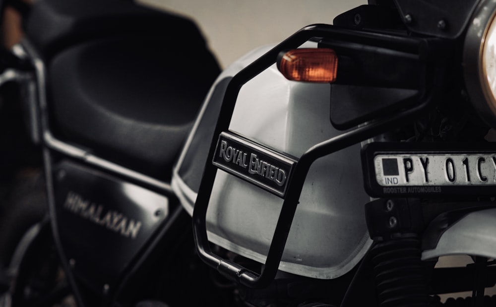 a close up of a motorcycle with a license plate