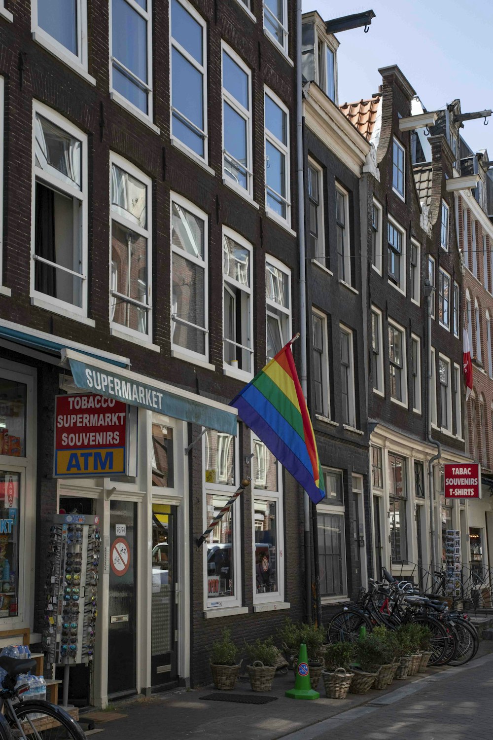 a rainbow colored umbrella in front of a store