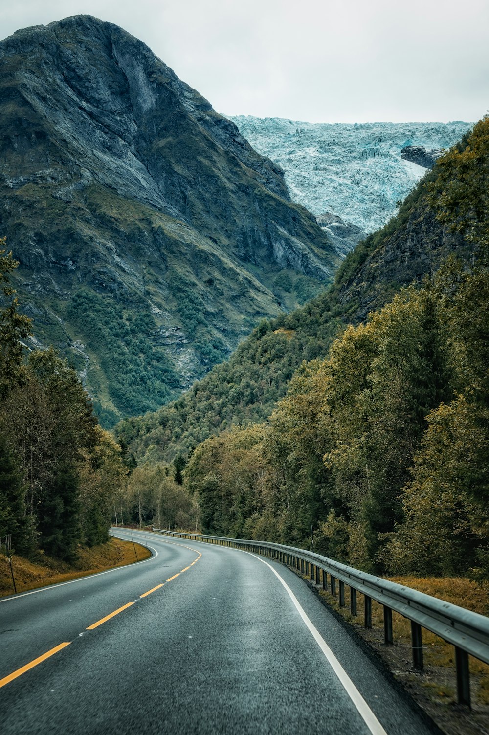 a road with a mountain in the background