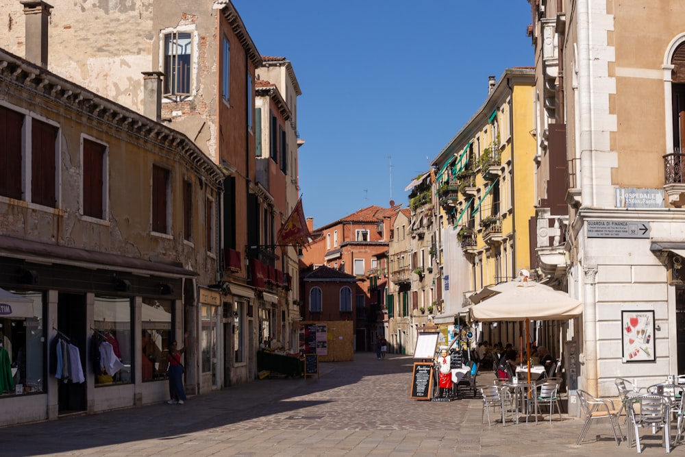 a city street with tables and chairs on it