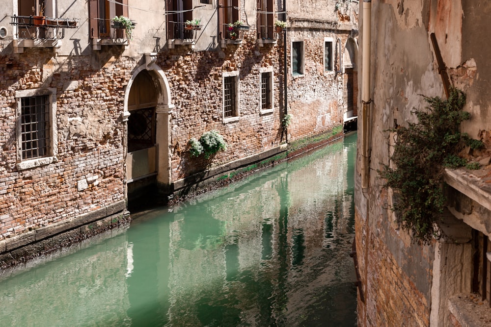 a narrow canal running between two buildings next to each other