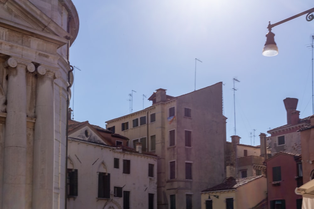 a street light in front of a row of buildings