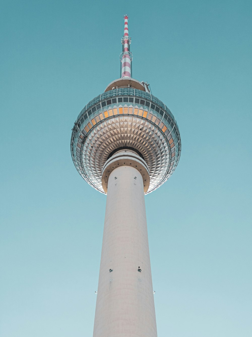 a tall white tower with a sky background