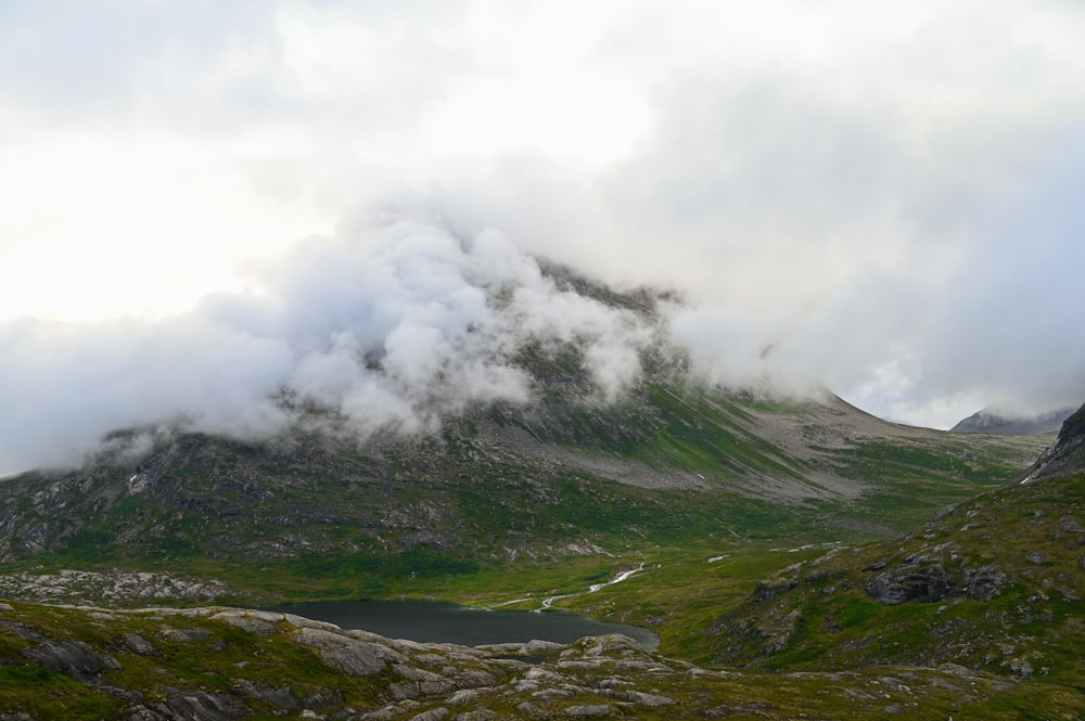 a mountain with a lake in the middle of it