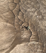 A cracked stone beginning to split open, hinting at the breakthrough moments in transformation.