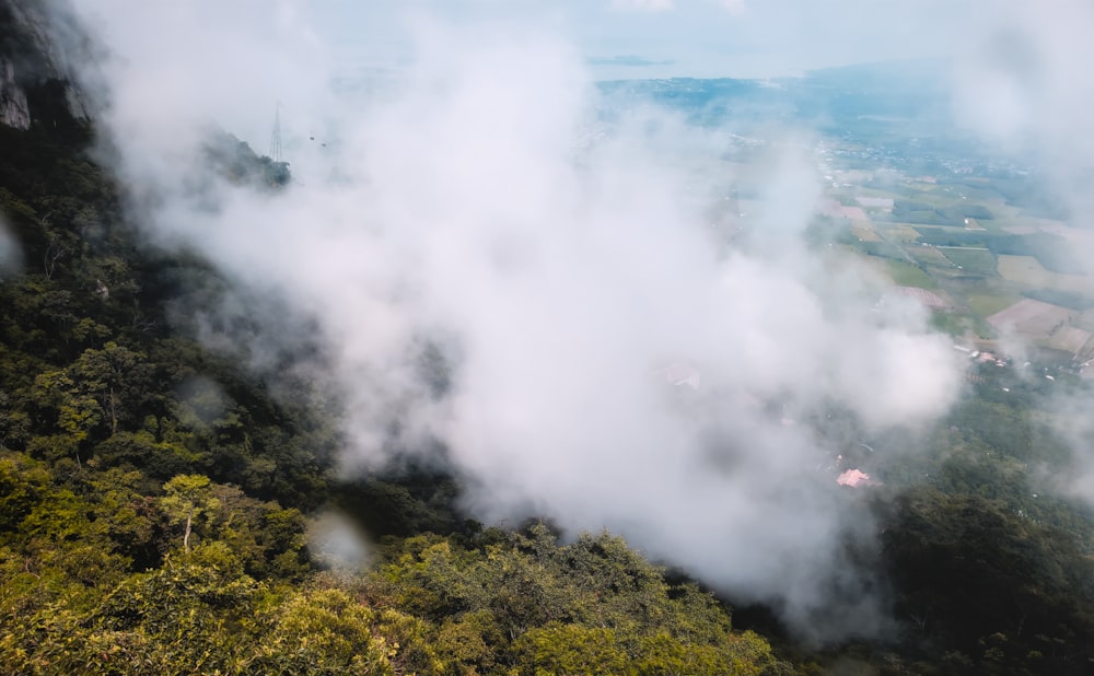 a view of a valley covered in clouds