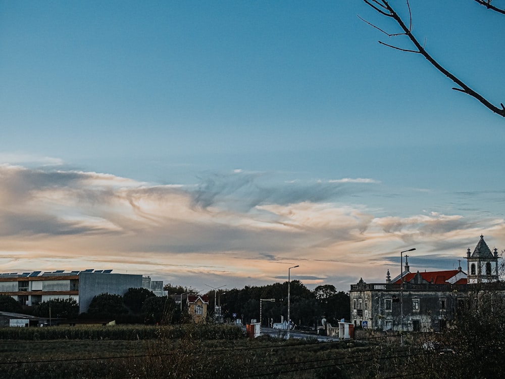 a view of a city with a clock tower in the distance