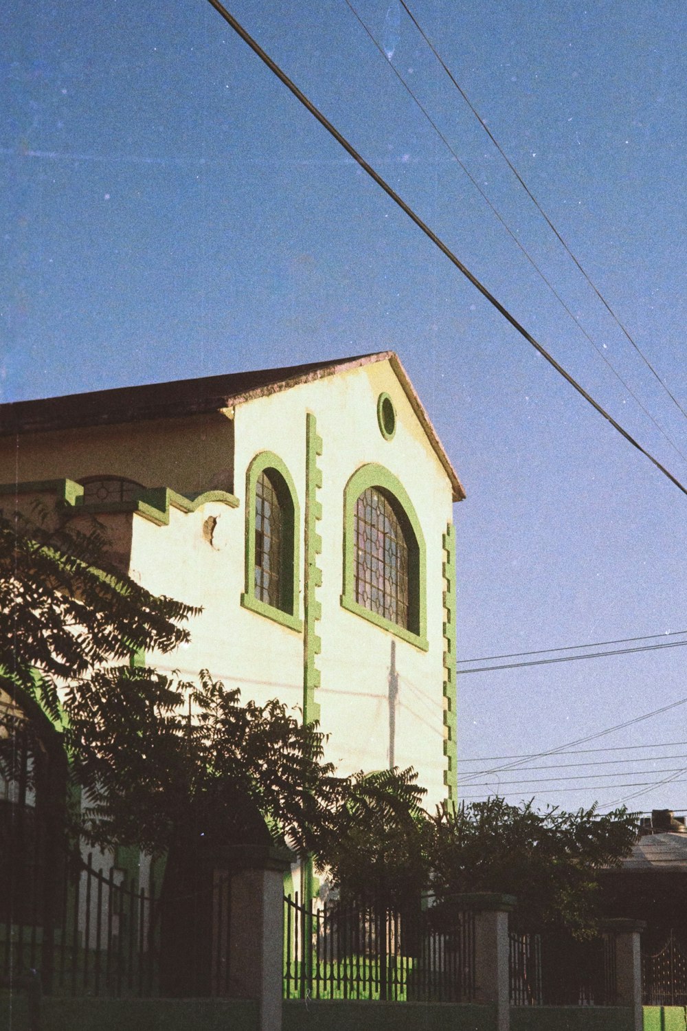 a large white building with a clock on the side of it