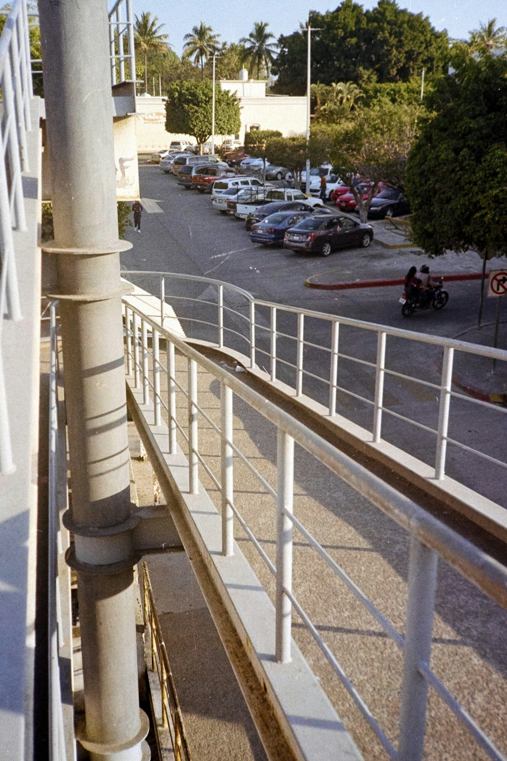 a view of a parking lot from a balcony