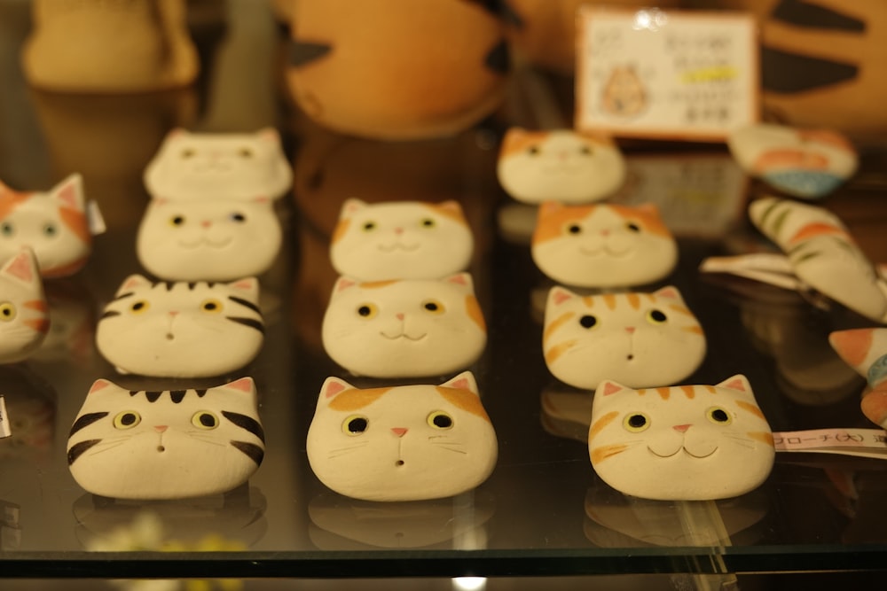 a display case filled with lots of fake cats