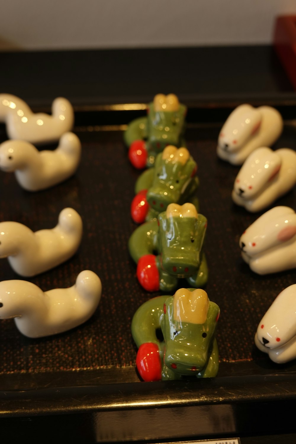 a row of toy animals sitting on top of a table