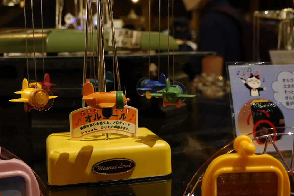 a group of toy airplanes hanging from strings