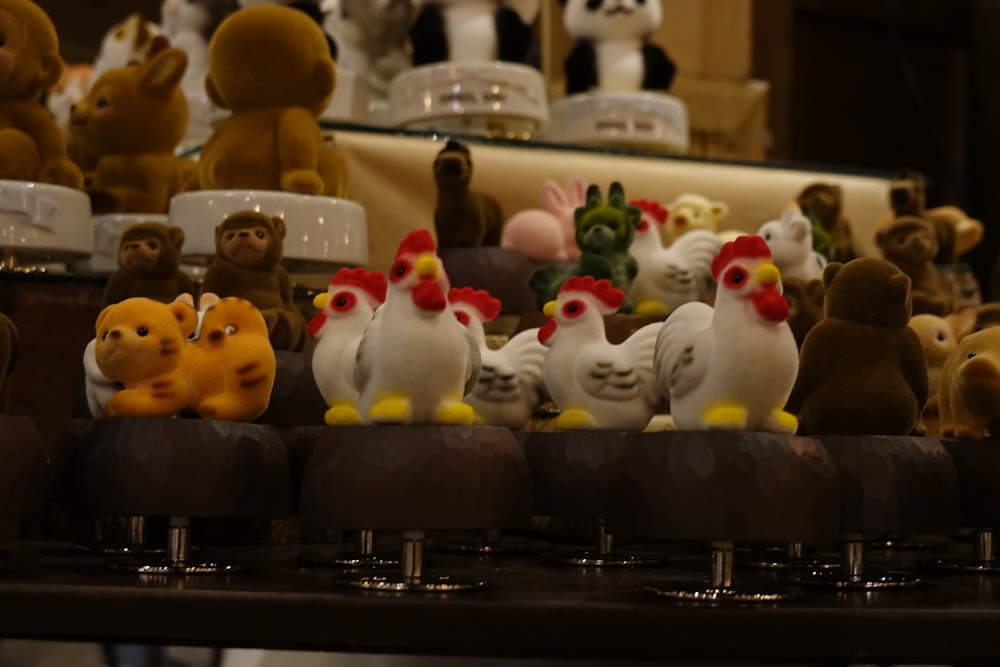 a table topped with lots of stuffed animals