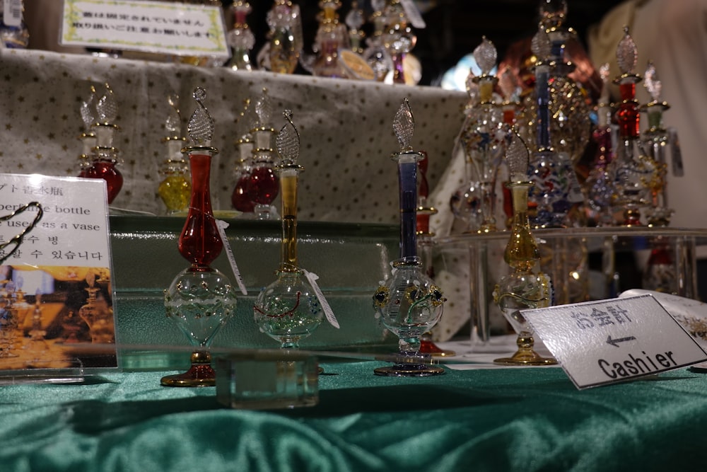 a table topped with lots of wine glasses