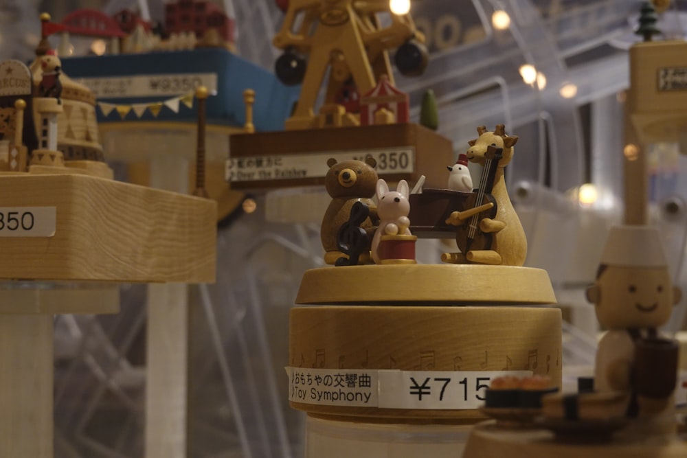 a group of wooden toy animals sitting on top of a table