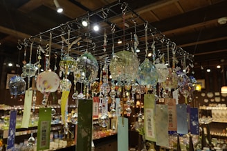 a bunch of glass balls hanging from a ceiling