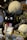 A variety of plush toys and merchandise featuring characters from a popular animated movie are displayed. The toys include large and small plush figures of a large grey creature with a white belly and a smaller black cat with a red bow. Surrounding these are various packaged items with character designs.