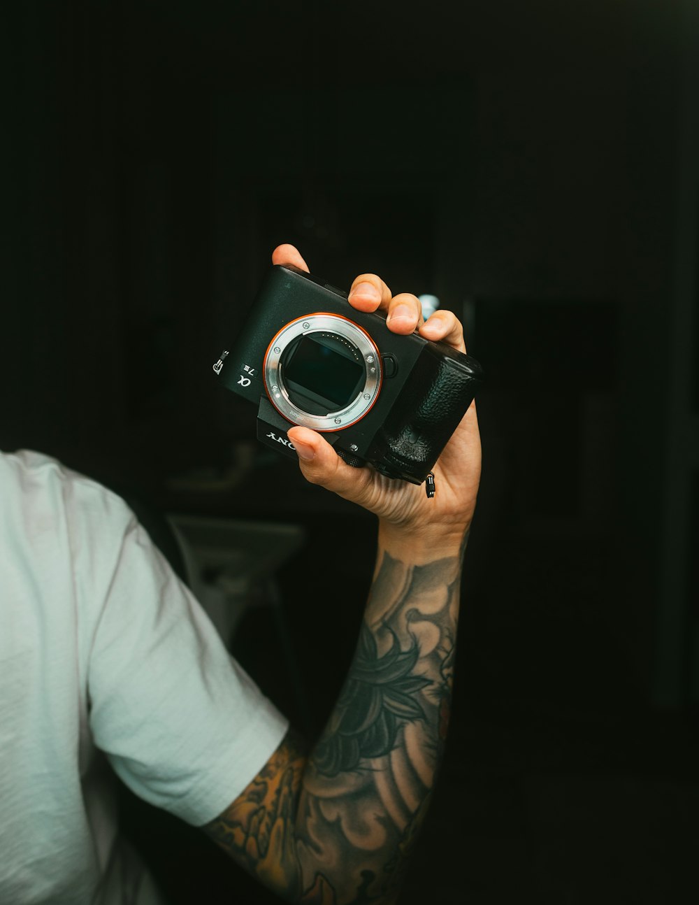 a man holding a camera in his hand