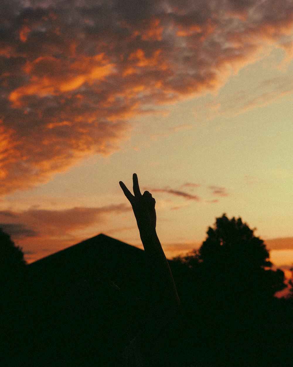 a person holding their hand up in the air