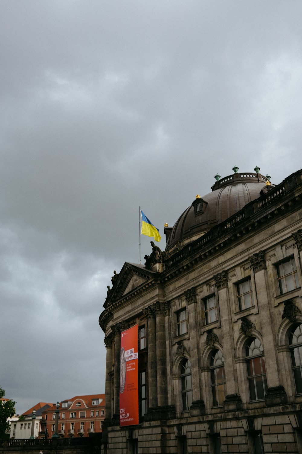 a large building with a flag on top of it