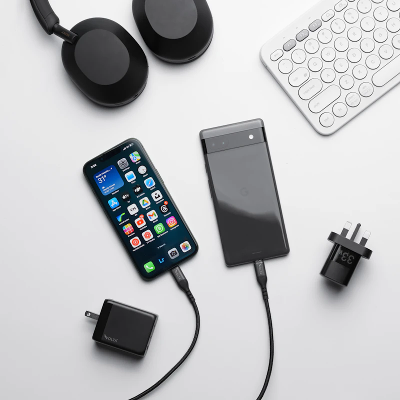 smartphone plugged in charging on desk (variant 3)