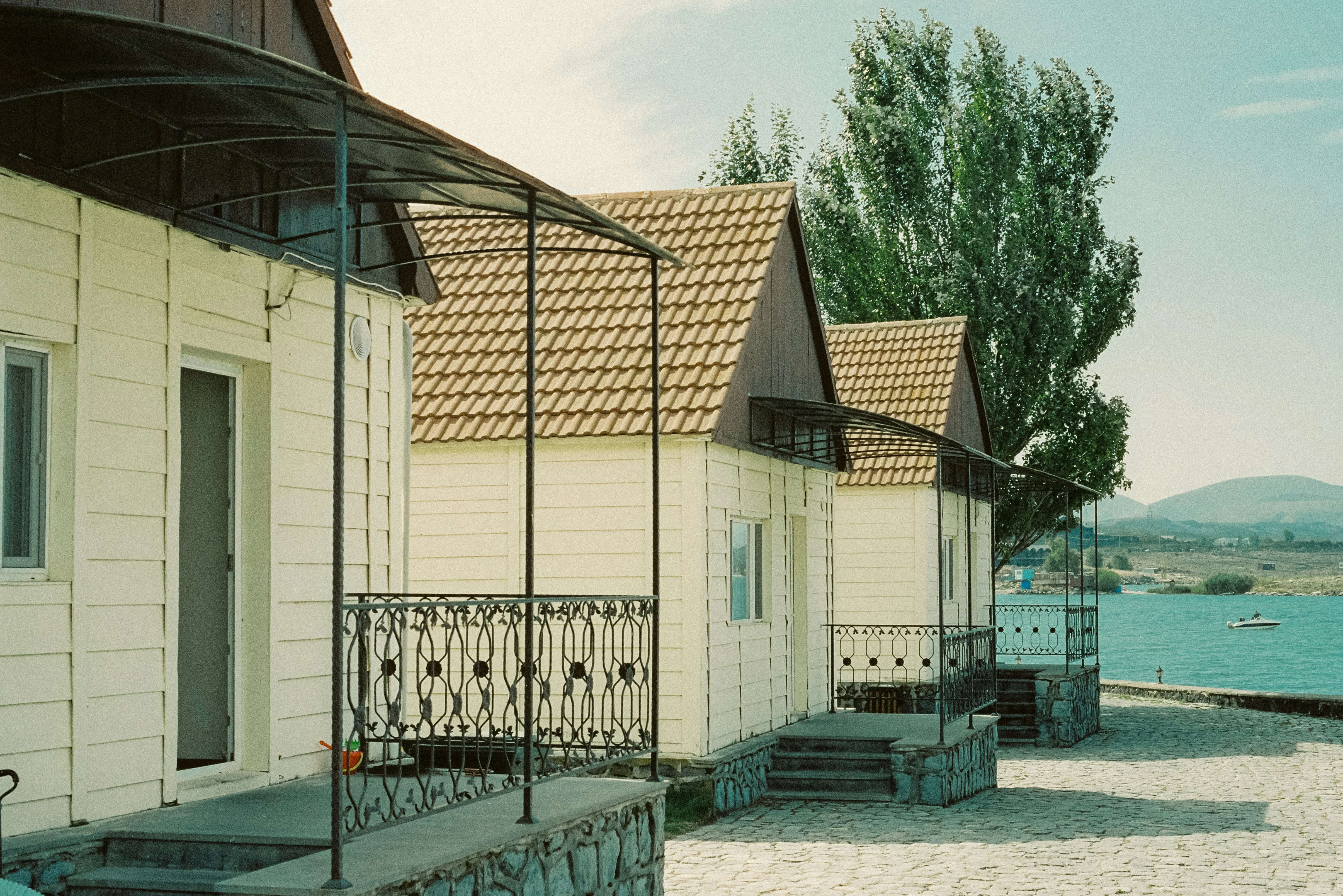 a row of houses next to a body of water