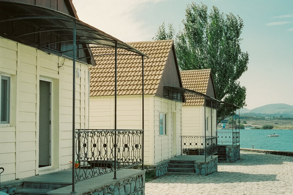 a row of houses next to a body of water