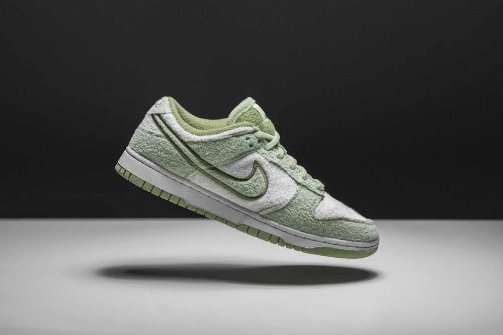 a pair of green and white sneakers