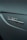 An emblem displaying the word 'Turbo' alongside an AMG logo on a metallic car surface, with smooth curves and a glossy finish.