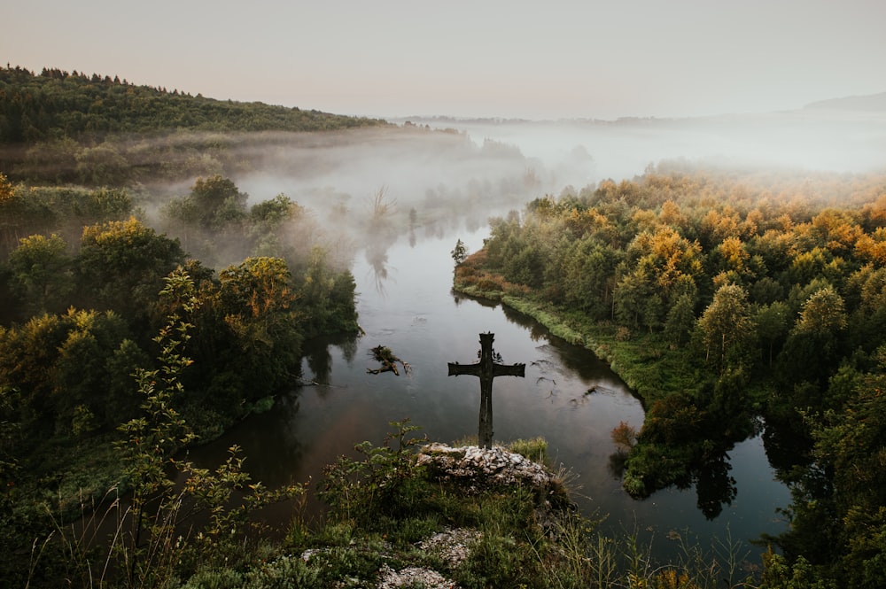 a river with a cross in the middle of it