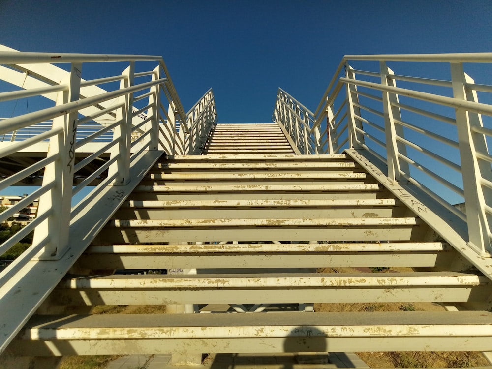 a set of stairs leading up to a beach