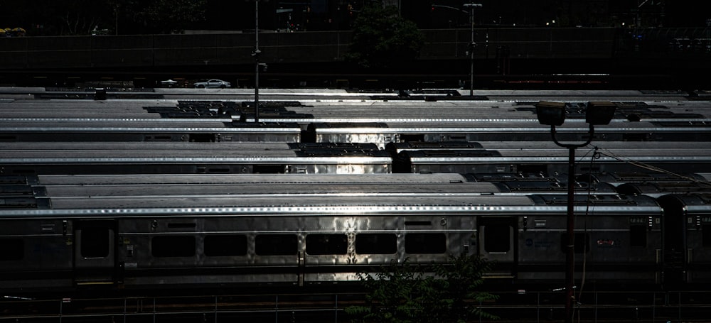 a bunch of trains that are sitting in the dark