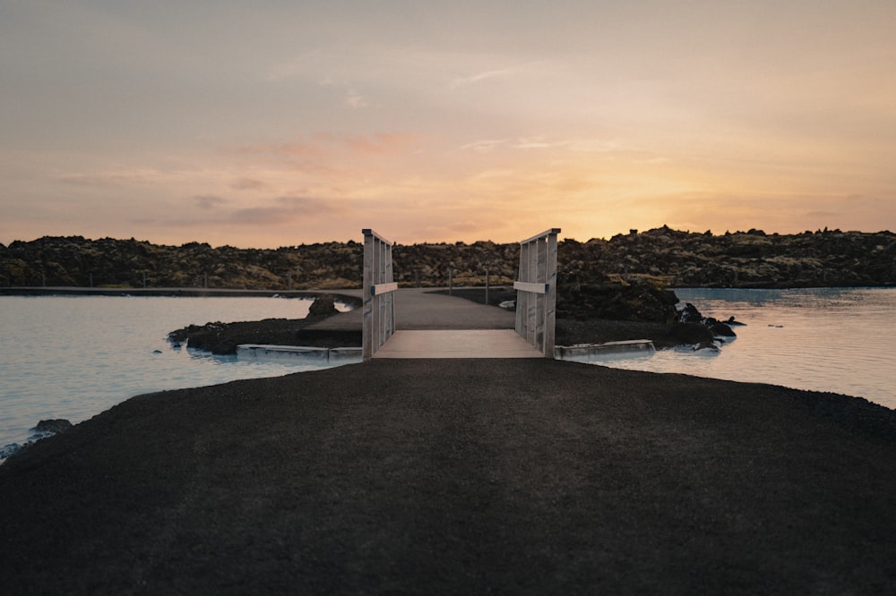 an open door leading into a body of water