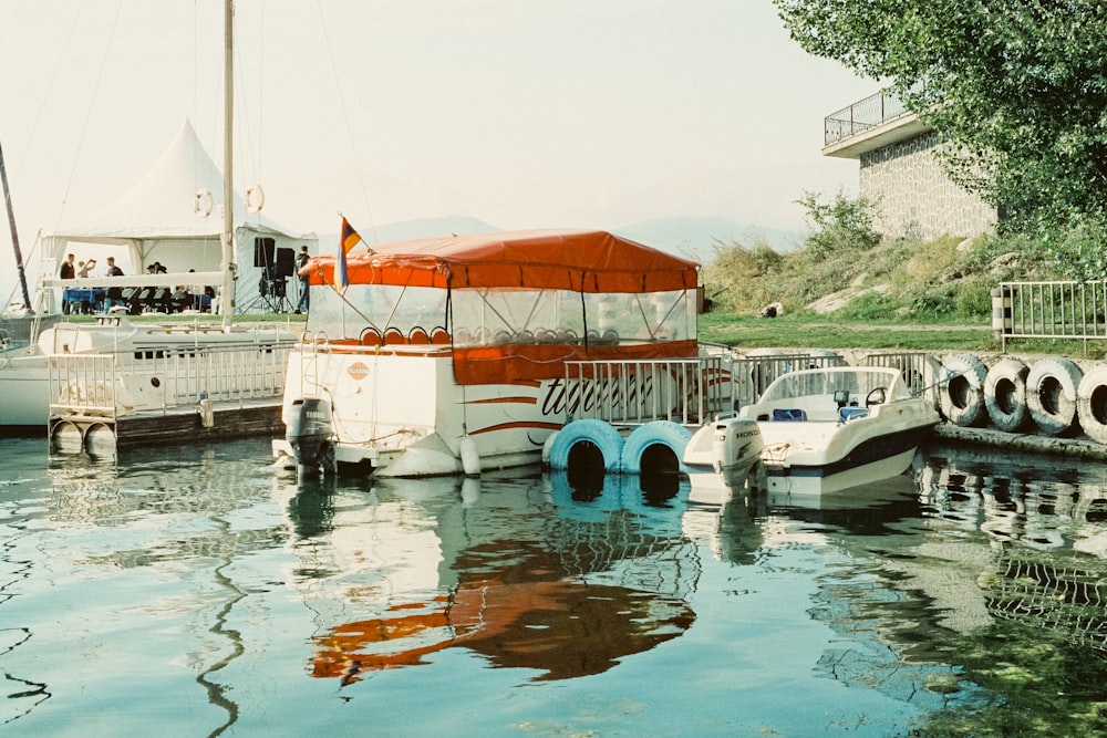 a group of boats parked next to a dock