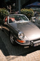 An exclusive modern classic car captured on a quiet cobblestone street in the UK.