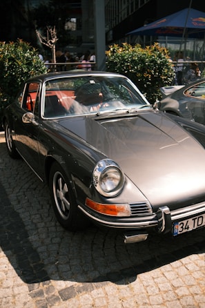 An exclusive modern classic car captured on a quiet cobblestone street in the UK.