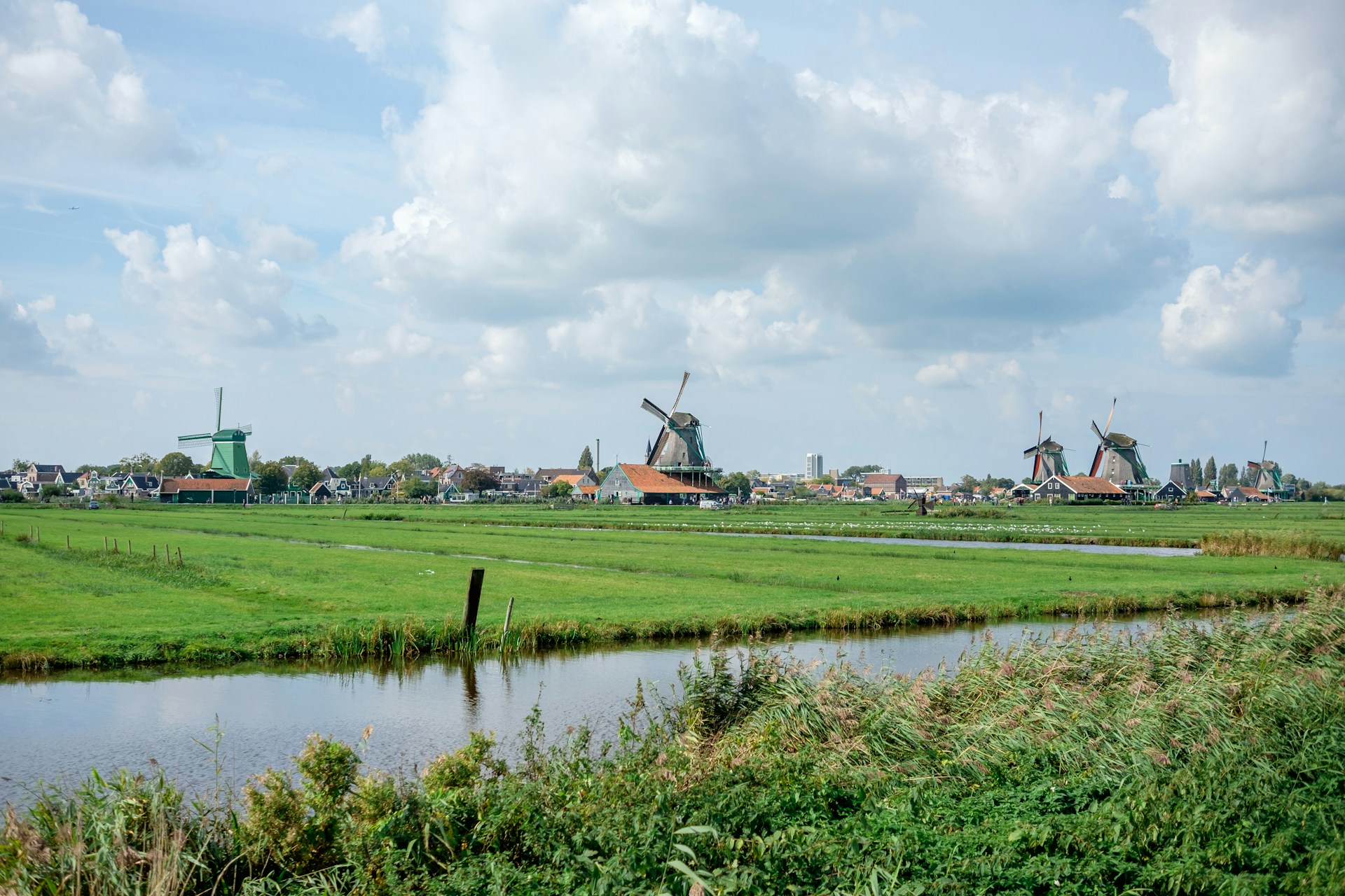 a river running through a lush green countryside