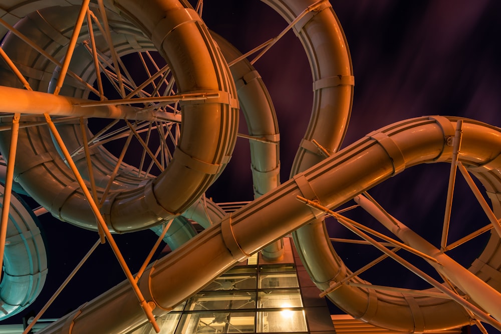 a large water slide next to a tall building