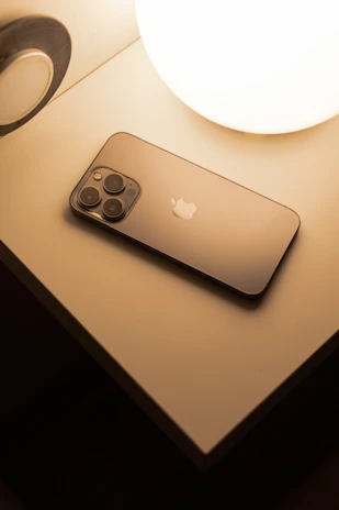 Close-up of a sleek aivera smart device glowing softly in a cozy home setting.