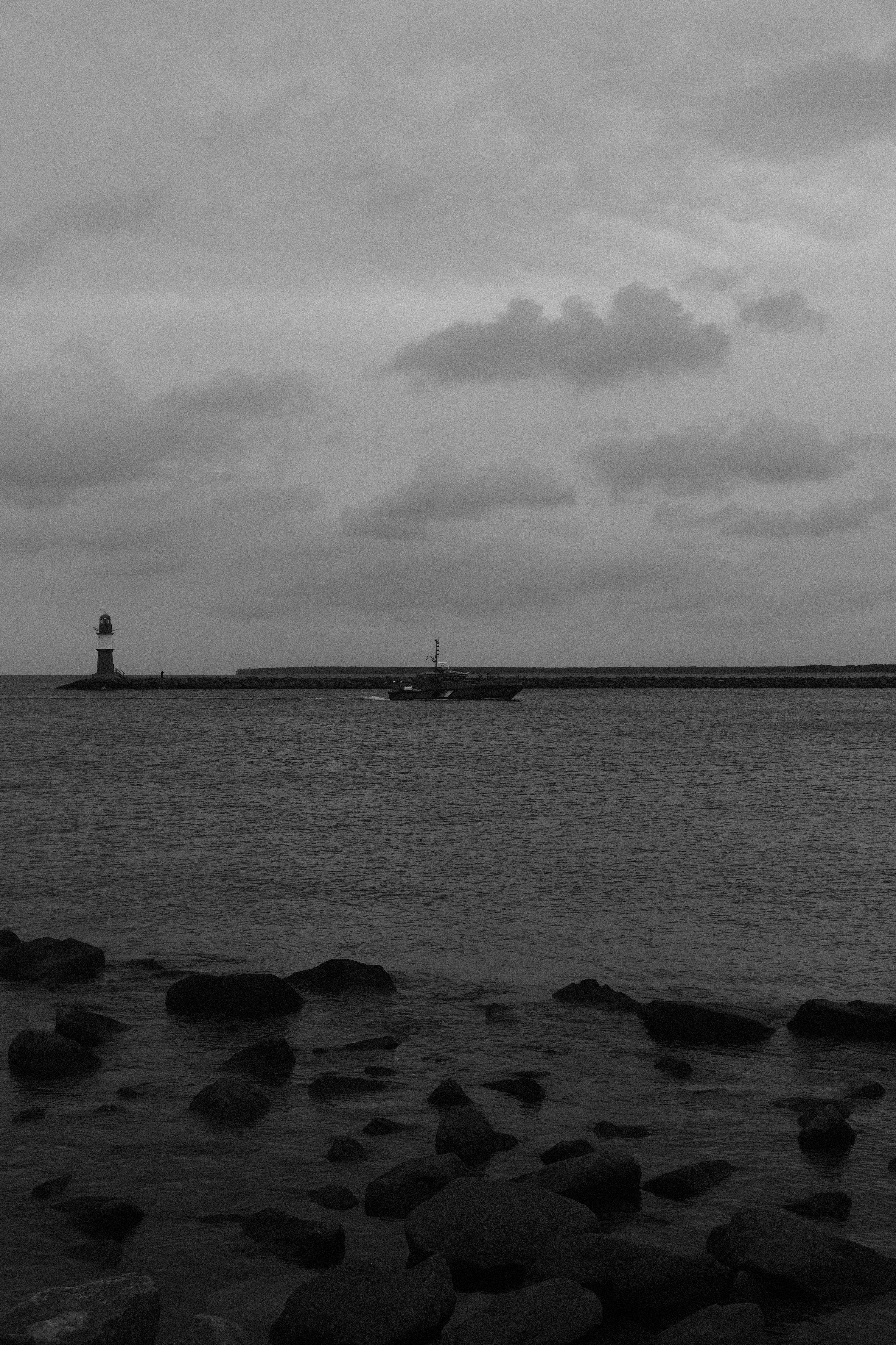 a black and white photo of a boat in the water