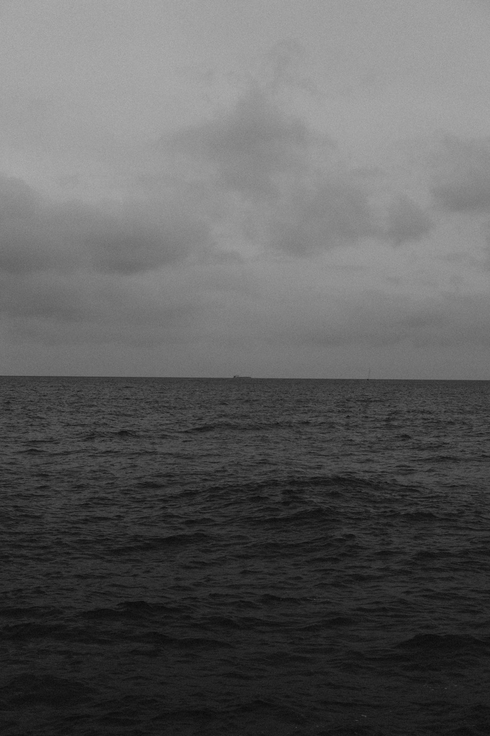 a black and white photo of the ocean