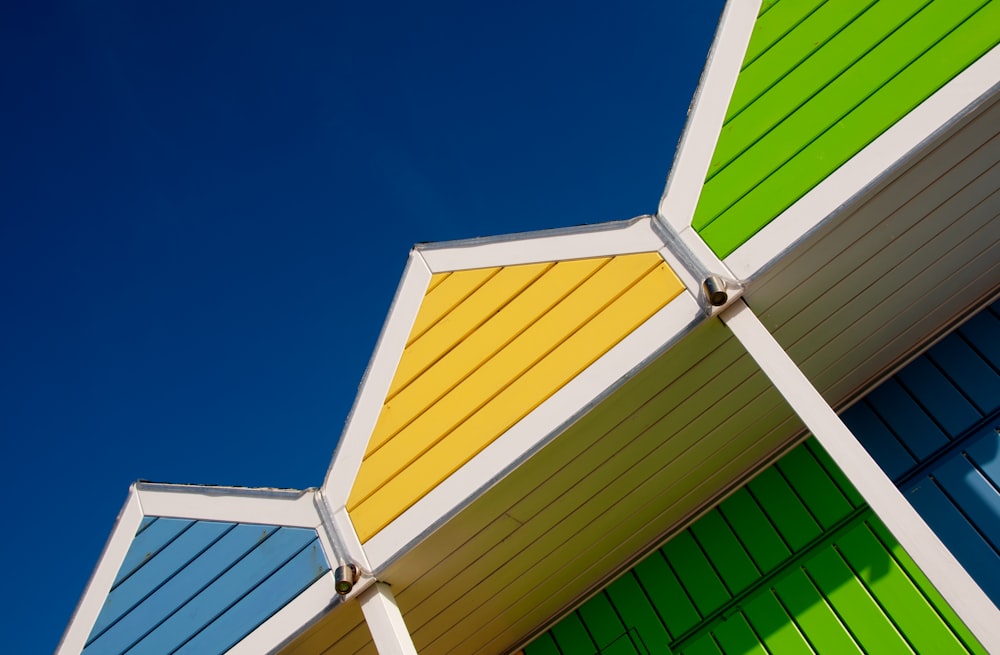 a multicolored building with a blue sky in the background