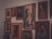 A diverse collection of artistic portraits displayed in a modern gallery setting.