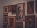A diverse collection of artistic portraits displayed in a modern gallery setting.