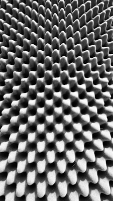 Textured stupwork embroidery piece with raised patterns creating a three-dimensional effect.