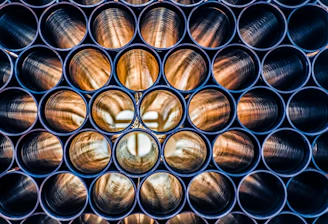 a bunch of metal pipes that are stacked together