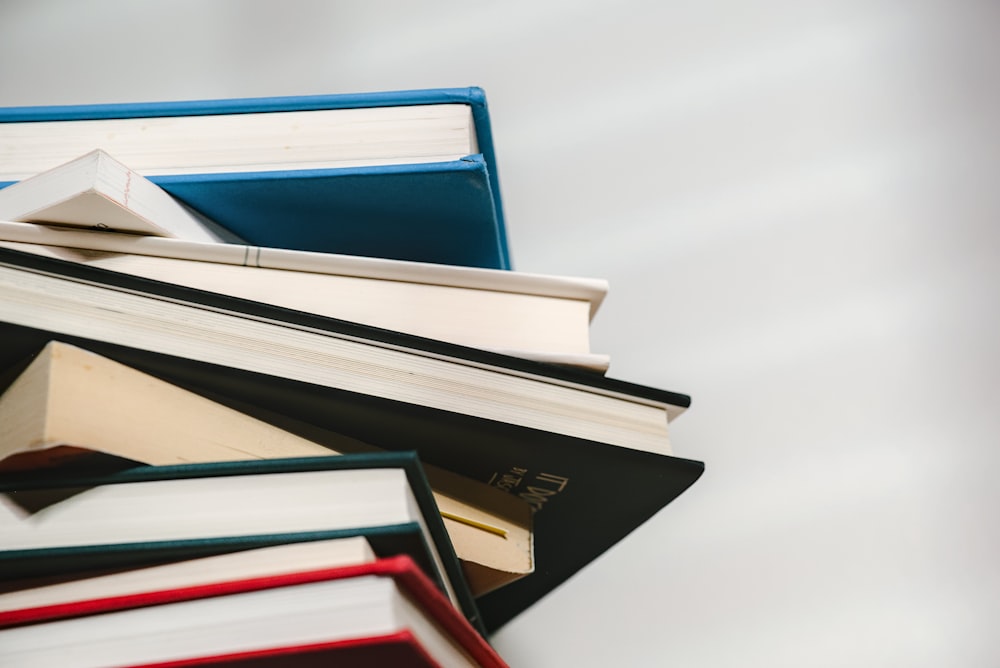 a stack of books sitting on top of each other