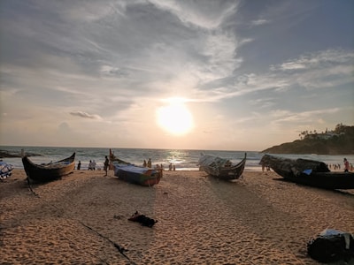 Sunset view over Singkawang beach with fishermen boats gently floating