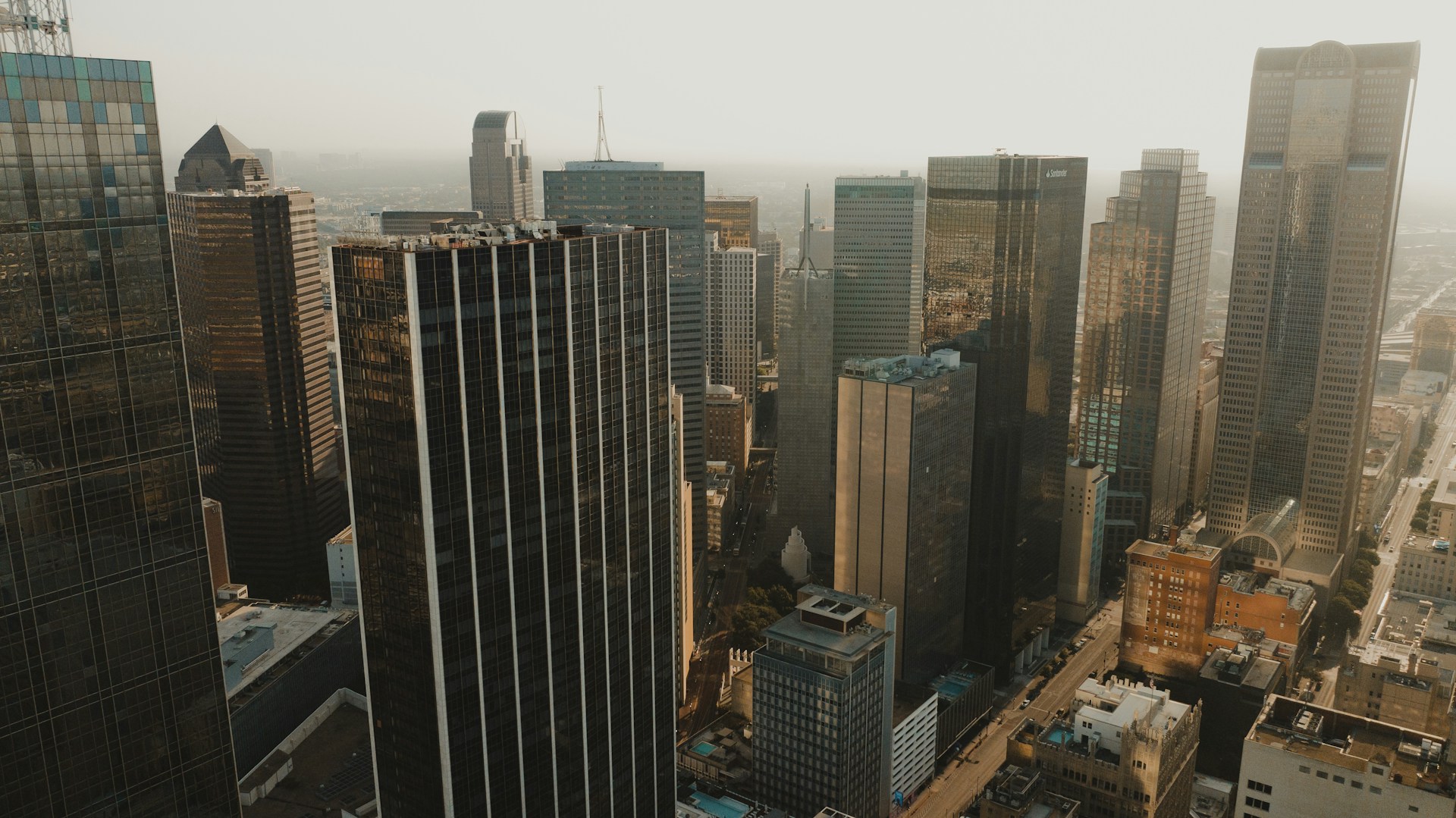 an aerial view of a city with tall buildings